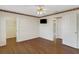 Bedroom featuring hardwood floors, fan, and closet access at 324 Lake Mariam Blvd, Winter Haven, FL 33884