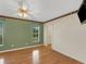 Cozy bedroom featuring hardwood floors, a window, and closet at 324 Lake Mariam Blvd, Winter Haven, FL 33884