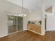 Dining area with hardwood floors, chandelier, and access to kitchen through pass through at 324 Lake Mariam Blvd, Winter Haven, FL 33884