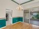 Formal dining room featuring hardwood floors, chandelier, and sliding door access to patio at 324 Lake Mariam Blvd, Winter Haven, FL 33884