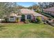 Charming single-story home with a well-manicured lawn and colorful landscaping at 324 Lake Mariam Blvd, Winter Haven, FL 33884