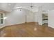 Expansive living room featuring hardwood floors, vaulted ceilings, and skylights at 324 Lake Mariam Blvd, Winter Haven, FL 33884