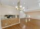 Bright, open living area with hardwood floors, high ceilings, and kitchen view at 324 Lake Mariam Blvd, Winter Haven, FL 33884