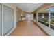 Screened lanai with an outdoor kitchen, tile floors, and views of the private backyard at 324 Lake Mariam Blvd, Winter Haven, FL 33884