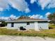 The exterior of the house includes an A/C unit and a white door at 3291 Alberta St, Bartow, FL 33830