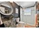 Modern bathroom featuring a black vessel sink, stylish vanity and glass enclosed shower at 335 Osprey Landing Way, Lakeland, FL 33813