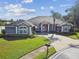 Charming home featuring a well-manicured lawn, inviting entrance, and a convenient mailbox, adding to its curb appeal at 335 Osprey Landing Way, Lakeland, FL 33813