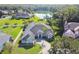 Beautiful exterior view of the home with a red front door, well-manicured lawn, and inviting curb appeal at 335 Osprey Landing Way, Lakeland, FL 33813