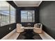 Cozy sitting room featuring stylish chairs, accent table, and large windows at 335 Osprey Landing Way, Lakeland, FL 33813