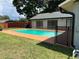 Inviting in-ground pool with a concrete deck and a well-maintained backyard at 362 Pasco Ct, Winter Haven, FL 33884