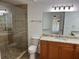 Modern bathroom with a glass shower and vanity with granite countertop at 362 Pasco Ct, Winter Haven, FL 33884