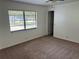 Bedroom with neutral carpet and one large window at 362 Pasco Ct, Winter Haven, FL 33884