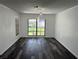 Bright dining room with black floors and updated light fixtures at 362 Pasco Ct, Winter Haven, FL 33884