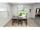 Dining table with view of lake through sliding glass doors leading to the lanai at 3862 Willow Ridge Dr, Lakeland, FL 33810