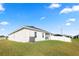 Exterior view of the home showcasing a well-manicured lawn and modern design at 3862 Willow Ridge Dr, Lakeland, FL 33810