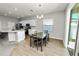 Kitchen and dining area with new appliances, recessed lights, and wood-look flooring at 3862 Willow Ridge Dr, Lakeland, FL 33810