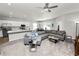 Open-concept living space leading to the kitchen with stainless steel appliances and a granite countertop island at 3862 Willow Ridge Dr, Lakeland, FL 33810