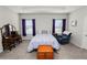 Well-lit main bedroom featuring a tray ceiling, comfortable chair and vintage vanity at 3862 Willow Ridge Dr, Lakeland, FL 33810