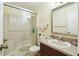 Bathroom featuring walk-in shower with glass door and vanity with mirror at 3901 Oak Loop # 33, Mulberry, FL 33860