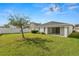 Spacious backyard with lush green lawn and white fence at 3961 Hampton Hills W Dr, Lakeland, FL 33810