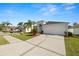 Beautiful single-story home with manicured landscaping and a two-car garage at 3961 Hampton Hills W Dr, Lakeland, FL 33810