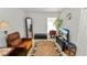 Cozy living room featuring a leather armchair and decorative rug at 3961 Hampton Hills W Dr, Lakeland, FL 33810