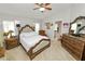 This main bedroom is well-lit with multiple windows and features a large dresser at 3961 Hampton Hills W Dr, Lakeland, FL 33810