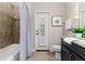 Bathroom featuring granite countertop, tile floor, and a door to the outside at 4002 Sunset Lake Dr, Lakeland, FL 33810