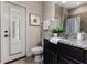 Bathroom featuring granite countertop, tile floor, and a door to the outside at 4002 Sunset Lake Dr, Lakeland, FL 33810