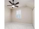 Bedroom with white walls, light carpet, ceiling fan and window with plantation shutters at 4002 Sunset Lake Dr, Lakeland, FL 33810