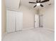 Bedroom with white walls, light carpet, ceiling fan and double door closet at 4002 Sunset Lake Dr, Lakeland, FL 33810