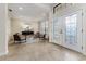 Elegant foyer with decorative glass front doors, tile flooring, and seating area at 4002 Sunset Lake Dr, Lakeland, FL 33810