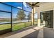 Enclosed porch featuring gorgeous pond view at 4002 Sunset Lake Dr, Lakeland, FL 33810