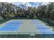 Aerial view of the community's multiple well-maintained tennis courts at 4002 Sunset Lake Dr, Lakeland, FL 33810