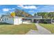 Well maintained backyard featuring a shed, pathways, grassy areas, and partial views of an above ground pool at 4035 Crews Ln, Lakeland, FL 33813