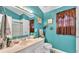 Charming bathroom featuring a white vanity, toilet, and coastal themed decor in a bright space at 4035 Crews Ln, Lakeland, FL 33813