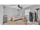 Cozy bedroom featuring neutral walls, ceiling fan, and a comfortable twin bed with colorful quilt at 4035 Crews Ln, Lakeland, FL 33813