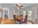 Inviting dining area with table, seating for six, and sliding glass doors to the backyard at 4035 Crews Ln, Lakeland, FL 33813