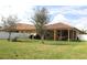 Beautiful backyard featuring green grass, a patio, and a hammock for relaxing at 4080 Prima Lago Cir, Lakeland, FL 33810