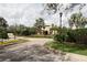 Inviting community entrance with meticulously landscaped grounds and elegant architecture sets a welcoming tone at 4080 Prima Lago Cir, Lakeland, FL 33810