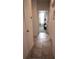 Hallway featuring a tile floor leading to the living area with a door to other rooms in the house at 4080 Prima Lago Cir, Lakeland, FL 33810