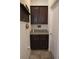 Mud room featuring dark cabinets, granite countertop, coat hooks, and entry to the home at 4080 Prima Lago Cir, Lakeland, FL 33810