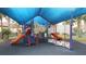 Fun playground featuring slides, climbing structures, and shaded seating, ideal for to play and socialize at 4080 Prima Lago Cir, Lakeland, FL 33810