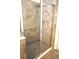 Walk in shower with shower head and extra handheld head, along with small storage for soaps at 4080 Prima Lago Cir, Lakeland, FL 33810