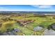 Aerial view of community featuring golf course, condominiums, and beautiful Florida landscape at 417 Enclave Pl # 2, Lakeland, FL 33803