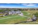 Aerial view of community golf course, clubhouse and perfectly manicured lawns at 417 Enclave Pl # 2, Lakeland, FL 33803