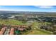 Gorgeous aerial view showcasing the community, ponds, and lush golf course at 417 Enclave Pl # 2, Lakeland, FL 33803