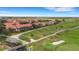 Condominiums with red roofs, manicured lawns, and nature trails throughout the community at 417 Enclave Pl # 2, Lakeland, FL 33803