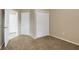 Bedroom featuring a carpeted floor, closet, and doorway leading to another room at 417 Enclave Pl # 2, Lakeland, FL 33803