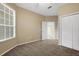 Bedroom featuring carpet floor, double closet and window with blinds at 417 Enclave Pl # 2, Lakeland, FL 33803